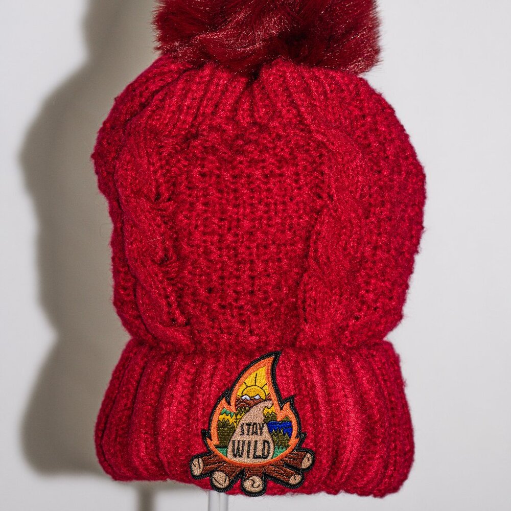 Red stocking cap with "Stay Wild" patch and fuzzy lining